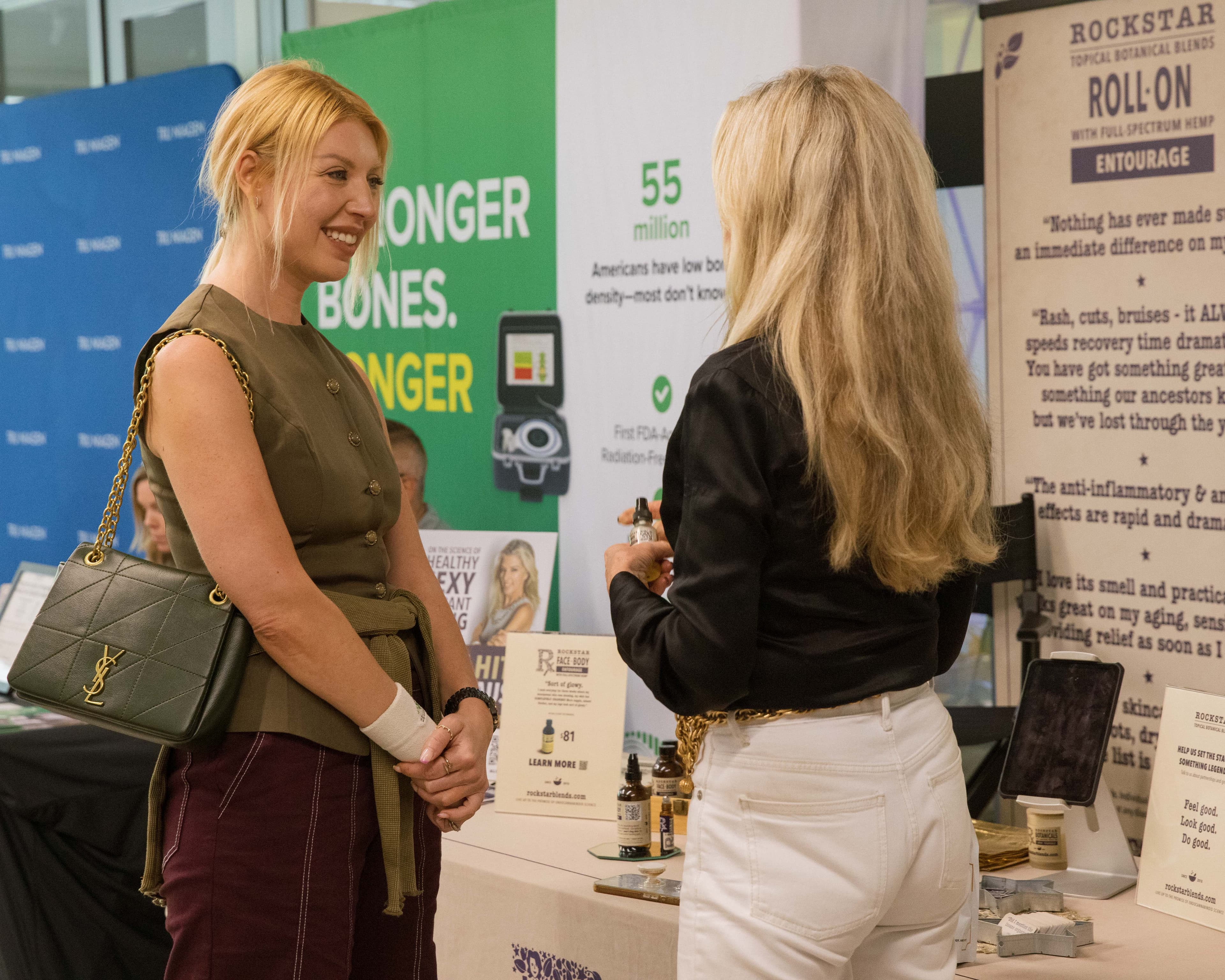 Women chatting at booth